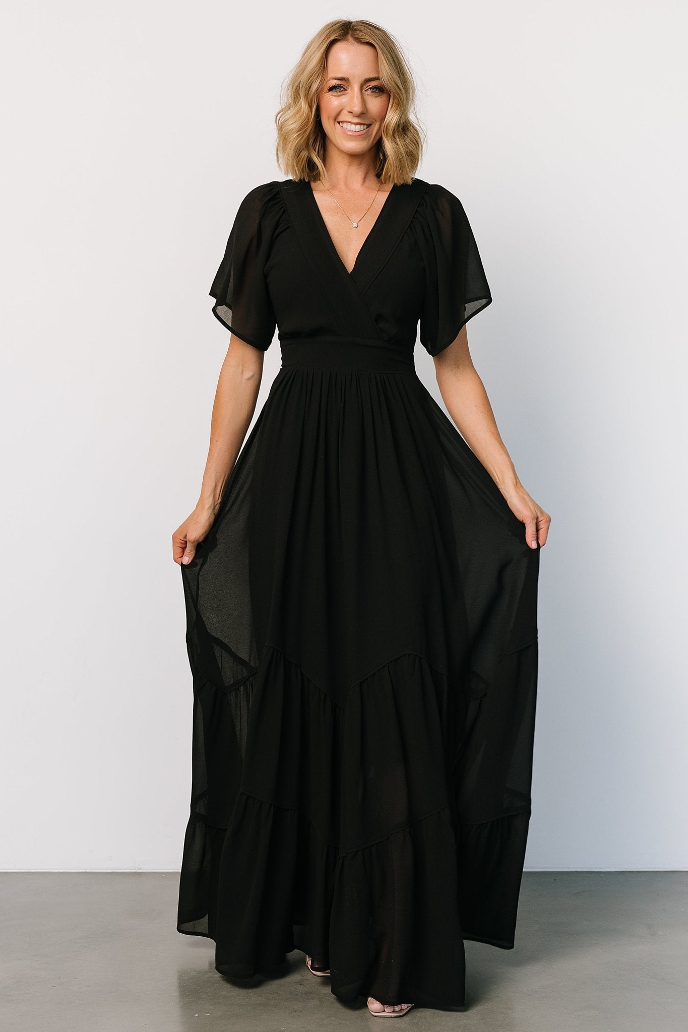 Black Surplice Neckline Maxi Dress with Flutter Sleeves | Baltic Born